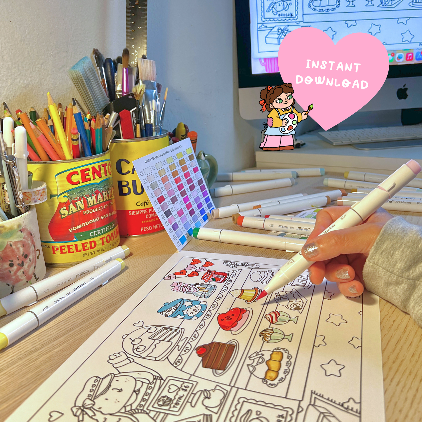 Coloring book with markers and stationery on a desk, featuring an 'Instant Download' card.